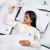 Woman sleeping peacefully on Sleepsotre memory foam pillow for better comfort and rest