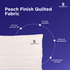 Peach finish quilted fabric pillow with soft feel, durability, breathability, and hypoallergenic.