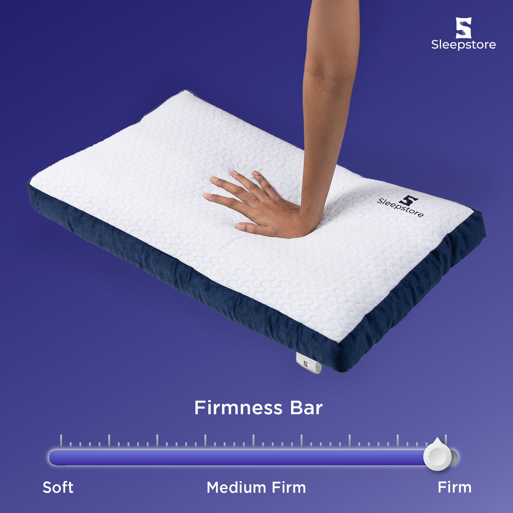 Hand pressing Sleepstore Fibrom Firm Pillow showing firmness level