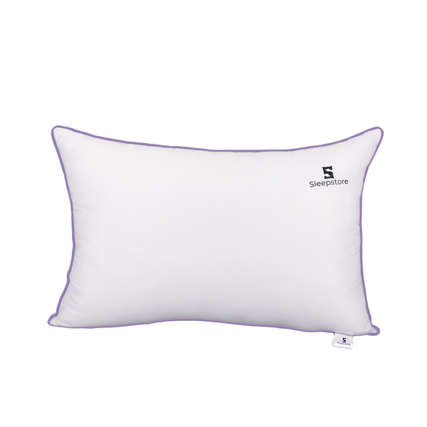 White rectangular Sleepstore pillow with purple piping and brand logo on the cover.