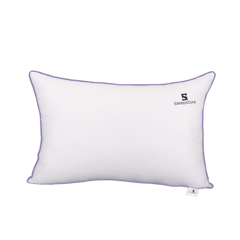 White rectangular Sleepstore pillow with purple piping and brand logo on the cover.