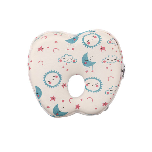 Baby pillow with cute sun, moon, and star print featuring a central head support hole.