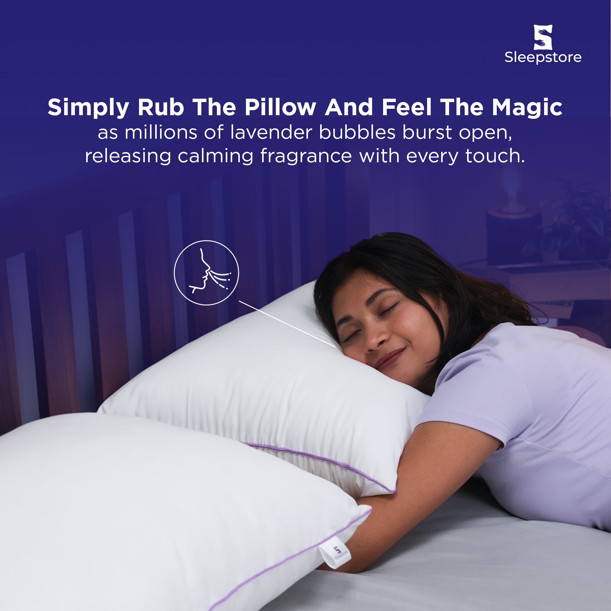 Woman smiling and resting on a Sleepstore lavender pillow for calming comfort.